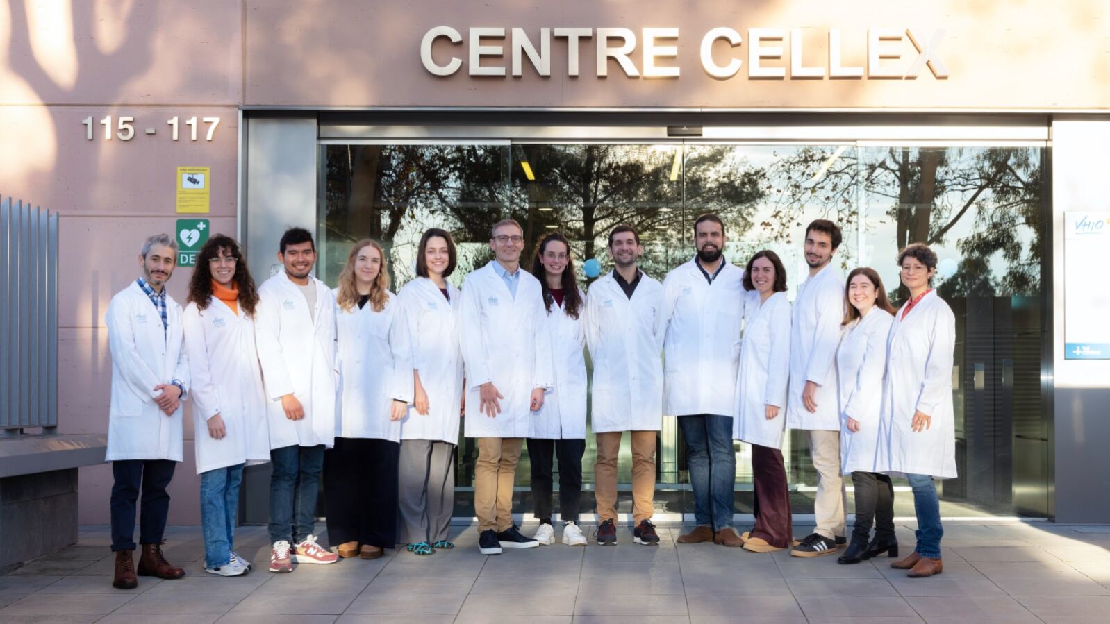 Group of scientists outside cellex building VHIO oncology data science cancer